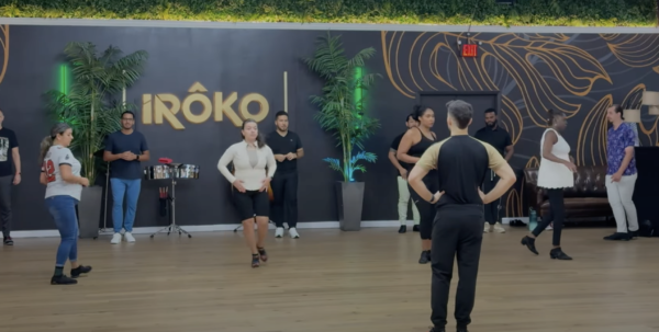 Salsa instructor leads class at Iroko Dance Acedemy.